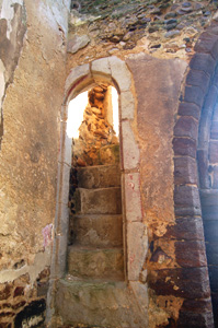 The stairs to the former rood screen on the north wall of the north arcade January 2011